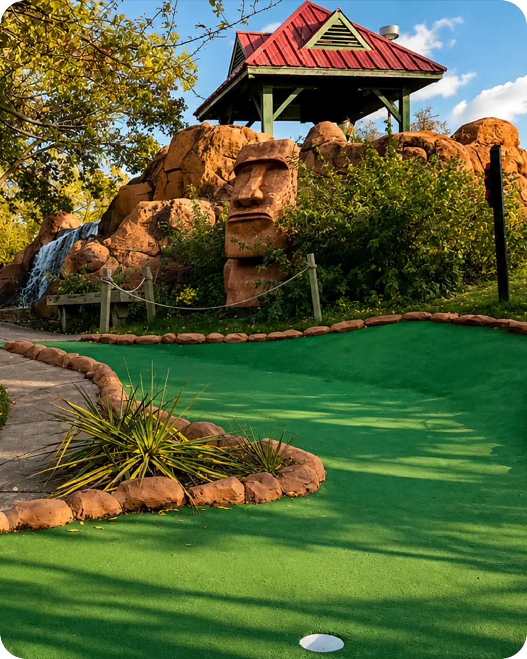 Lost Mountain mini golf course with a sculpted stone face