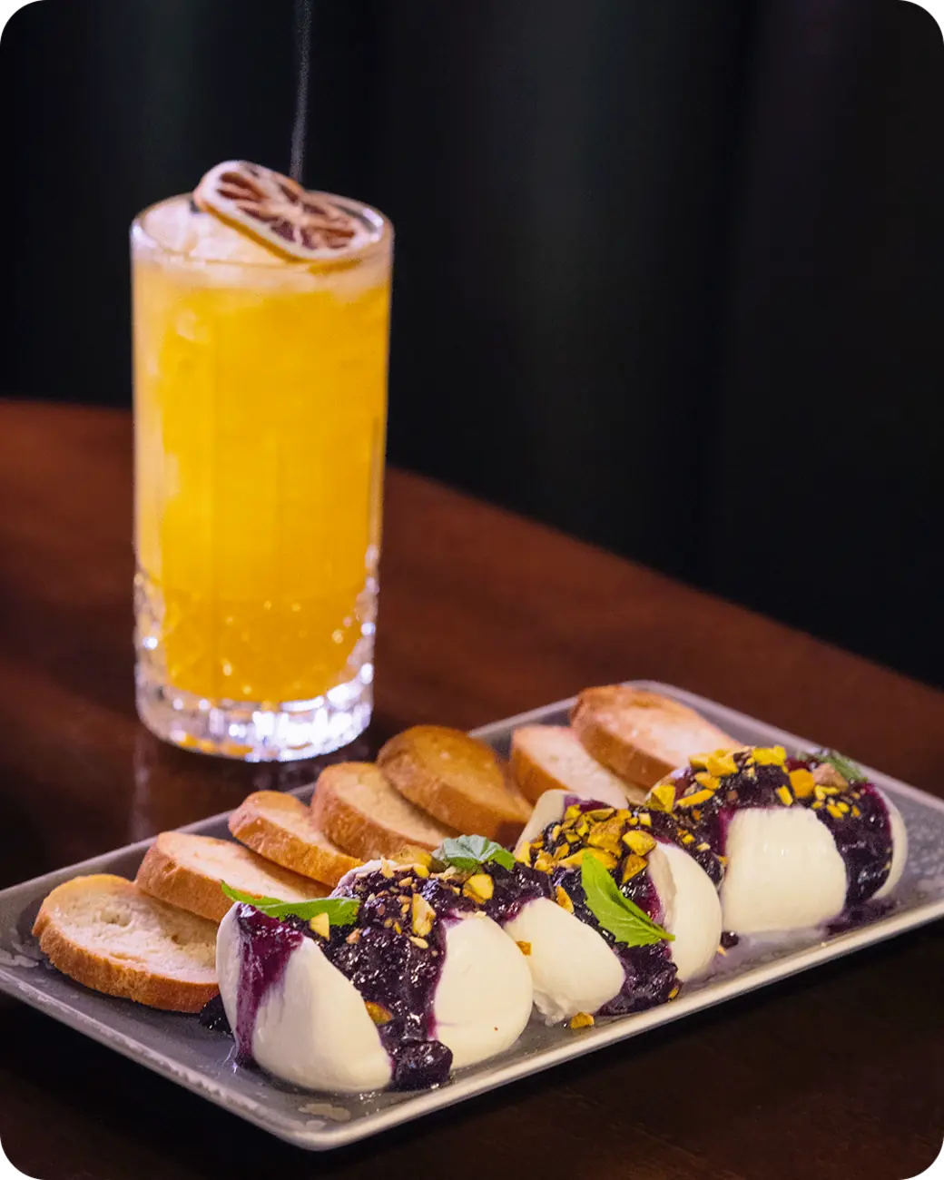 Burrata appetizer and cocktail at Whiskey Bend